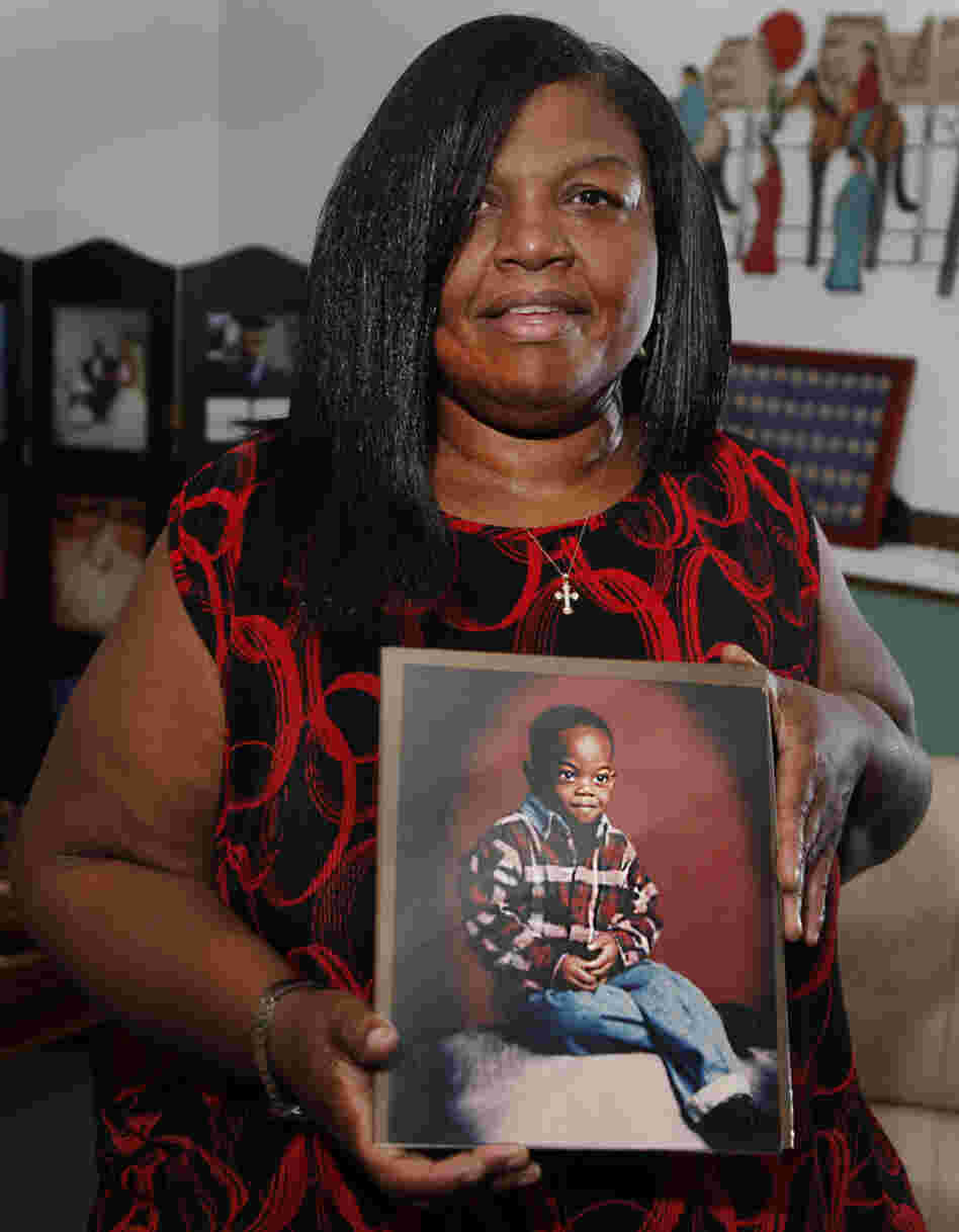 Sharletta Evans holds a photograph of her 3-year-old son Casson in Aurora, Colo., last July. Casson was killed in a drive-by shooting by two 15-year-olds. 