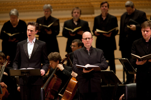 Tenor Ian Bostridge (left) sings the role of the evangelist, a kind of "reporter on the scene" telling the story of Jesus' arrest, trial, and crucifixion. He's joined by Bass-Baritone Neal Davies (center, as Jesus) and Bass-Baritone Hanno Muller-Brachmann.