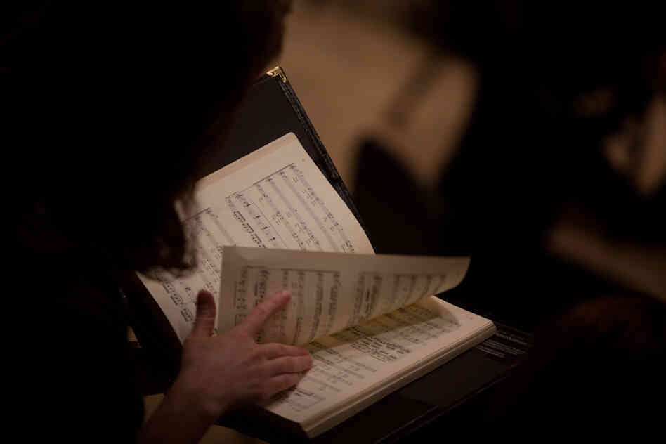 A member of the chorus, La Chapelle de Quebec looks at the score of Bach's St. John Passion, which he wrote for Good Friday services in Leipzig, in April of 1724.
