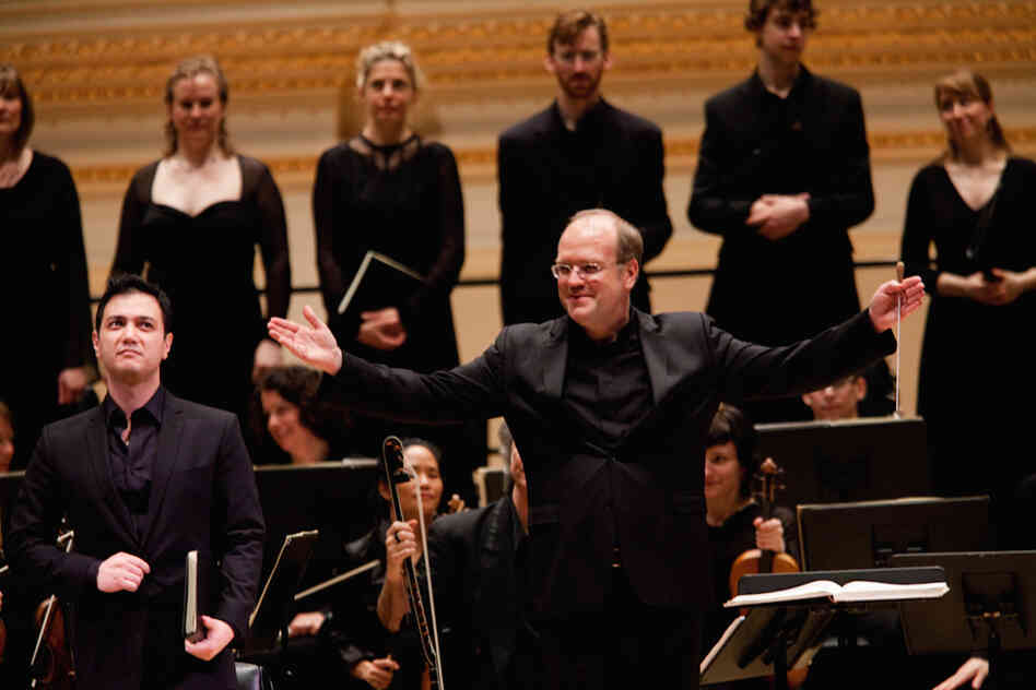 Conductor Bernard Labadie, the orchestra, chorus and soloists acknowledge the enthusiastic applause for their performance of Bach's St. John Passion. 