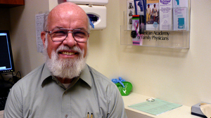 Dr. Glenn Hodges, a volunteer at Health Partnership Clinic in Johnson County, Kan., says he will continue to focus on those without coverage even if the clinic he volunteers at accepts Medicaid and private coverage.