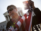 A protester holds up a copy of the U.S. Constitution outside the Supreme Court on Monday in Washington, D.C. A protester holds up a copy of the U.S. Constitution outside the Supreme Court on Monday in Washington, D.C.