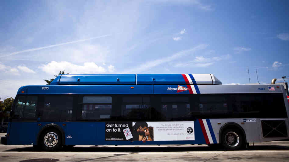 A bus in Washington, D.C., displays an advertisement for a female condom in July 2010. To encourage their use, community groups distributed more than 500,000 of the female condoms, flexible pouches that are wider than a male condom but similar in length, during instruction sessions at beauty salons, barber shops, churches and restaurants.