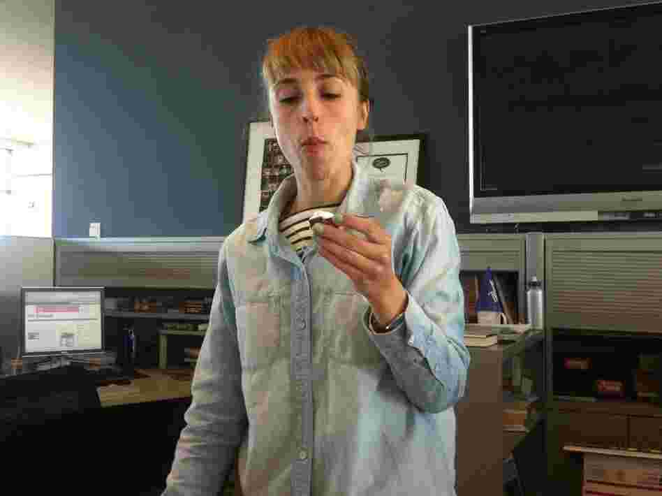 Eva regards the Deviled Cadbury Creme Egg as it should be regarded: suspiciously. 
