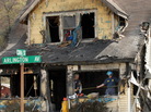 On Saturday, investigators sifted through debris in the aftermath of a house fire in Charleston, W.Va., that has now claimed nine lives. On Saturday, investigators sifted through debris in the aftermath of a house fire in Charleston, W.Va., that has now claimed nine lives.