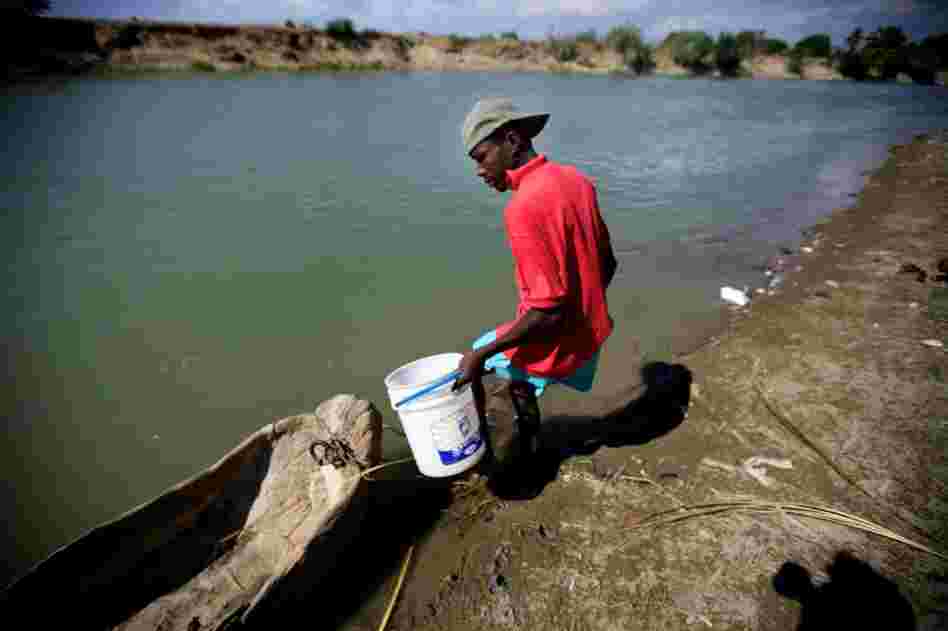 Most people in this rural part of Haiti, near Saint-Marc, get their water from the Artibonite River. Though the river is known to be contaminated with cholera, few can afford chlorine tablets to purify the water.