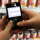 A shopper searches on her BlackBerry for coupons inside a Target store. Consumers with smartphones are changing the way stores set prices and track customer tastes. A shopper searches on her BlackBerry for coupons inside a Target store. Consumers with smartphones are changing the way stores set prices and track customer tastes.