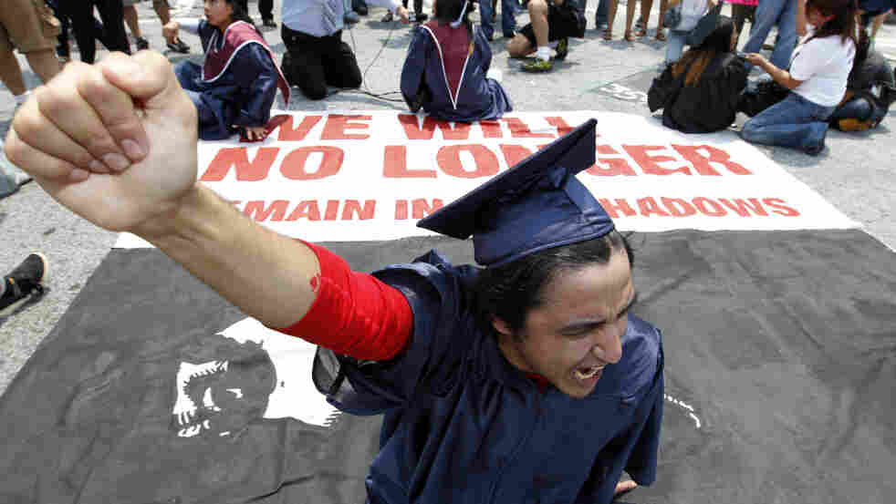 A protester blocks an Atlanta street during a rally protesting Georgia's new immigration law in June 2011. Now, the state's lawmakers are considering a bill that would also ban students here illegally from attending all public colleges. A protester blocks an Atlanta street during a rally protesting Georgia's new immigration law in June 2011. Now, the state's lawmakers are considering a bill that would also ban students here illegally from attending all public colleges.