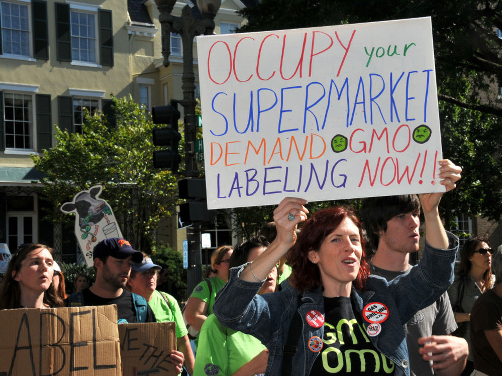 People march demanding labels for genetically modified food near the White House in Washington, D.C., on Oct. 16, 2011. 