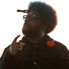 "Let's be real. We're all geeks in this room." ?uestlove, of The Roots, addresses the EMP Pop Conference on Sunday. At this moment, the drummer, producer and DJ was demonstrating the delighted confusion he tries to instigate on the dancefloor, which is why he spent years searching for the Spanish-language version of Kool and the Gang's "Celebration."