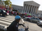 While some reporters inside scrambled to get word out, there were plenty of protesters and spectators outside the Supreme Court this morning. While some reporters inside scrambled to get word out, there were plenty of protesters and spectators outside the Supreme Court this morning.