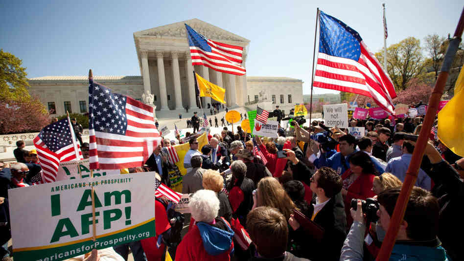 Demonstrators both for and against the new health care law turned out on the steps of the Supreme Court on Tuesday.