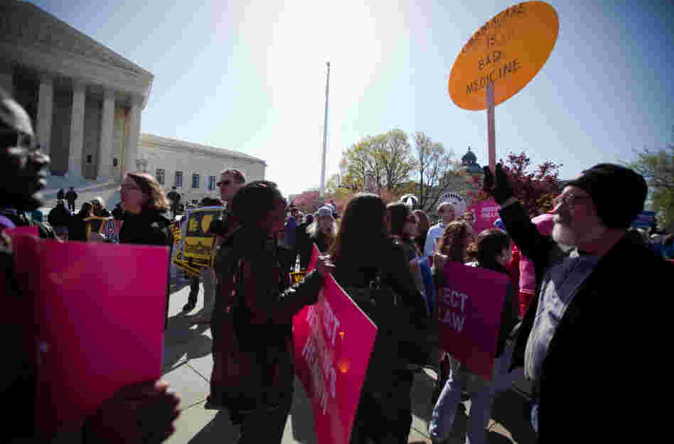 Supporters and opponents of the health care law rallied in front of the Supreme Court Tuesday, as the court considered the constitutionality of the insurance mandate. Supporters and opponents of the health care law rallied in front of the Supreme Court Tuesday, as the court considered the constitutionality of the insurance mandate.