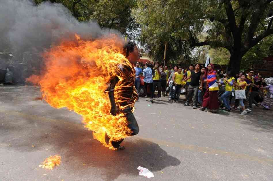 Tibetan exile Janphel Yeshi, 27, is engulfed in flames after he set himself on fire during a protest in New Delhi on March 26, 2012. 