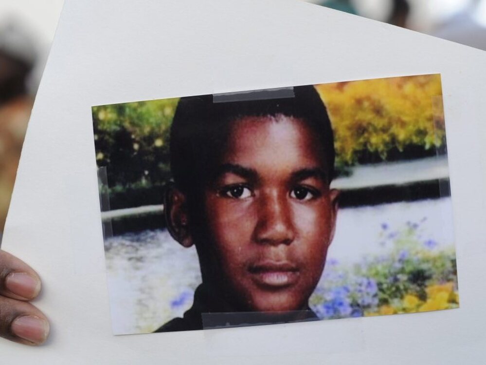 This photo of Trayvon Martin was held by a supporter during a recent rally in the Goldsboro neighborhood of Sanford, Fla.