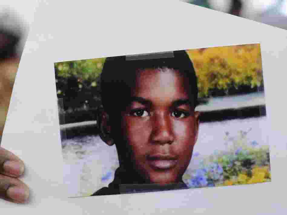 This photo of Trayvon Martin was held by a supporter during a recent rally in the Goldsboro neighborhood of Sanford, Fla.