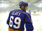 Smooth Move: Sean William Scott plays dimwitted but affable Doug Glatt, a small-town bouncer who happens upon an opportunity as a minor league hockey enforcer when managers discover his talent for delivering a beating. Smooth Move: Sean William Scott plays dimwitted but affable Doug Glatt, a small-town bouncer who happens upon an opportunity as a minor league hockey enforcer when managers discover his talent for delivering a beating.