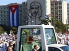 Back dropped by an image of Cuba's revolutionary hero Ernesto 'Che' Guevara, Pope Benedict XVI waves to faithful from his popemobile as arrives at Revolution Square for a Mass in Havana, Cuba on Wednesday. Back dropped by an image of Cuba's revolutionary hero Ernesto 'Che' Guevara, Pope Benedict XVI waves to faithful from his popemobile as arrives at Revolution Square for a Mass in Havana, Cuba on Wednesday.