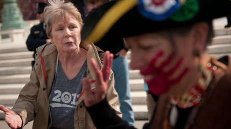 Holly Harness (left), a supporter of the health care law, argues with Susan Clark, an opponent of the law, outside the Supreme Court on Wednesday. Holly Harness (left), a supporter of the health care law, argues with Susan Clark, an opponent of the law, outside the Supreme Court on Wednesday.