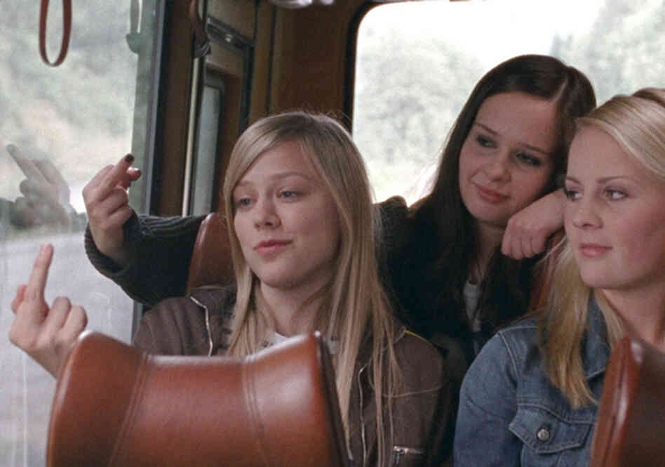 Alma and Sara (Malin Bjorhovde, center) flip the routine bird to the sign welcoming them to the small hometown they loathe, while Sara's sister Ingrid (Beate Stofring, right) looks on. Alma and Sara (Malin Bjorhovde, center) flip the routine bird to the sign welcoming them to the small hometown they loathe, while Sara's sister Ingrid (Beate Stofring, right) looks on.