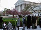 People wait for tickets to attend the last day of arguments over the Affordable Care Act at the Supreme Court. People wait for tickets to attend the last day of arguments over the Affordable Care Act at the Supreme Court.