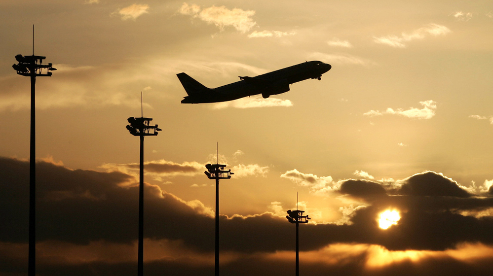 A jetliner takes off over the Beijing Capital International airport in Beijing on March 02 2008.