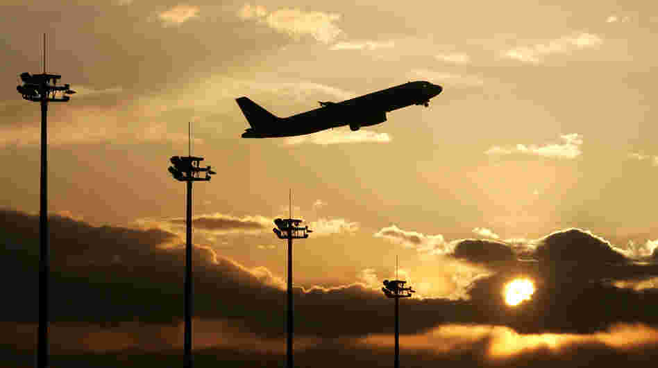 A jetliner takes off over the Beijing Capital International airport in Beijing on March 02 2008.