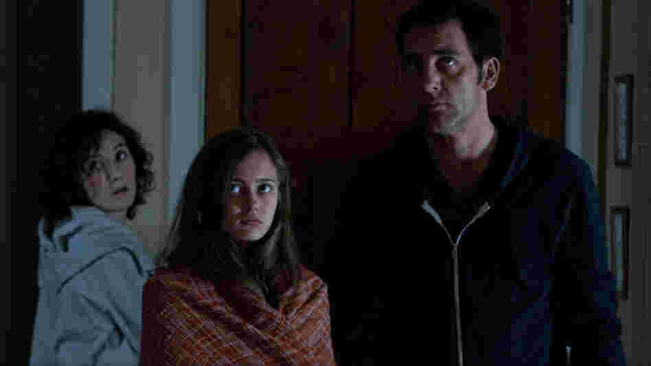 Mia (Ella Purnell, center) has nightmares that may or may not have something to do with the sins of her parents, Sue (Carice van Houten) and John (Clive Owen). Mia (Ella Purnell, center) has nightmares that may or may not have something to do with the sins of her parents, Sue (Carice van Houten) and John (Clive Owen).