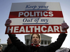Amy Brighton from Medina, Ohio, who opposes the new health care law, rallies in front of the Supreme Court on Tuesday. Amy Brighton from Medina, Ohio, who opposes the new health care law, rallies in front of the Supreme Court on Tuesday.