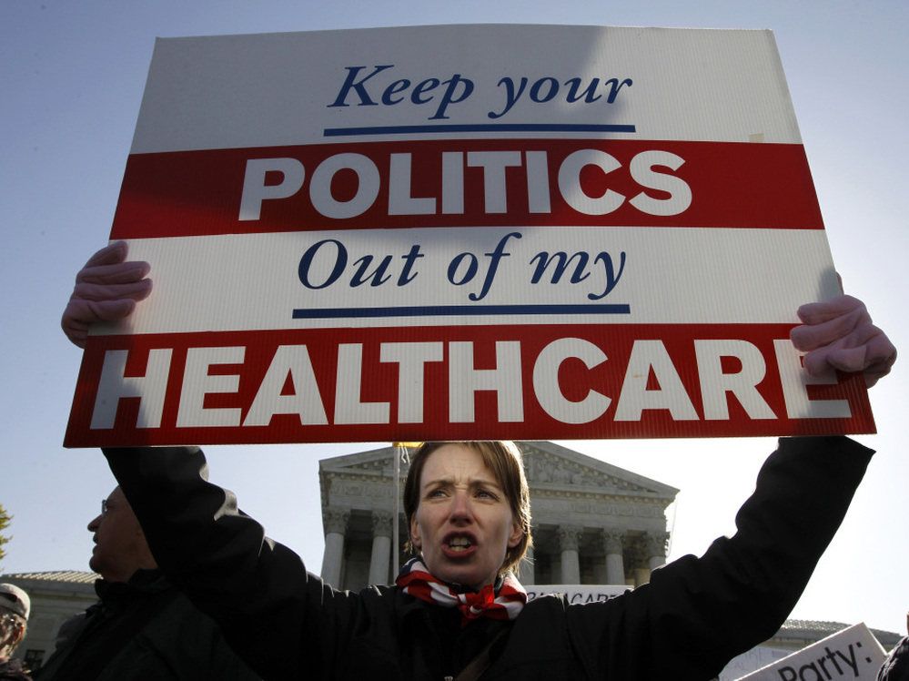 Amy Brighton from Medina, Ohio, who opposes the new health care law, rallies in front of the Supreme Court on Tuesday.
