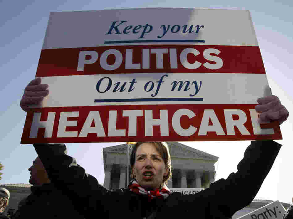 Amy Brighton from Medina, Ohio, who opposes the new health care law, rallies in front of the Supreme Court on Tuesday.