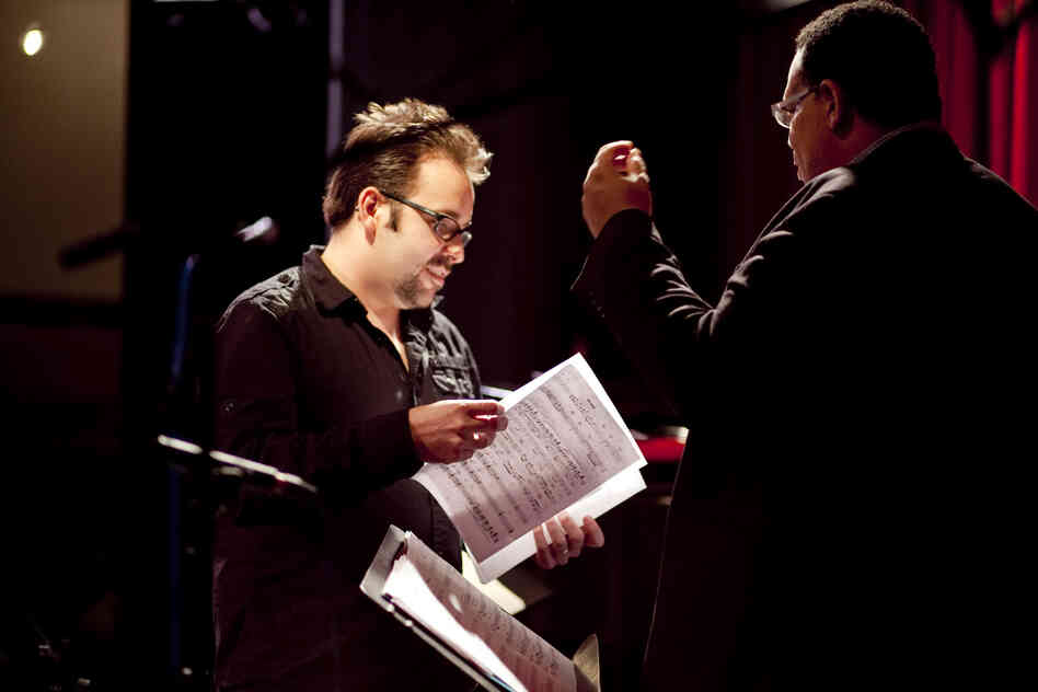 Manuel Valera speaks with John Benitez, prior to the performance.