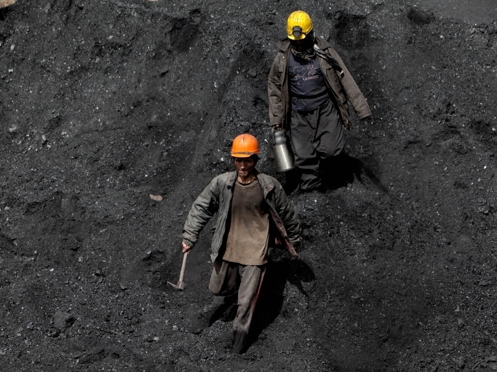 Afghan miners work a coal mine some 60 miles east of the western city of Herat, Afghanistan, in 2010. 