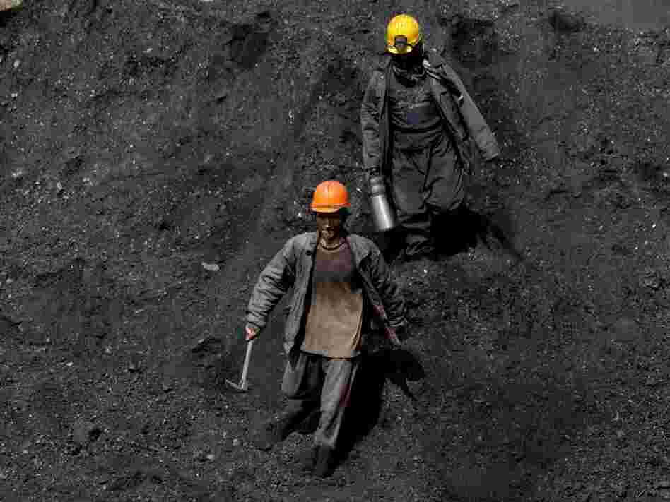 Afghan miners work a coal mine some 60 miles east of the western city of Herat, Afghanistan, in 2010. 