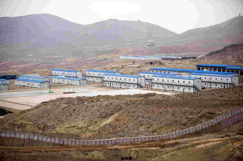 Hesco barriers and concertina wire surround the living quarters of the Chinese-owned Ainak copper mine in Logar, Afghanistan, in 2011.