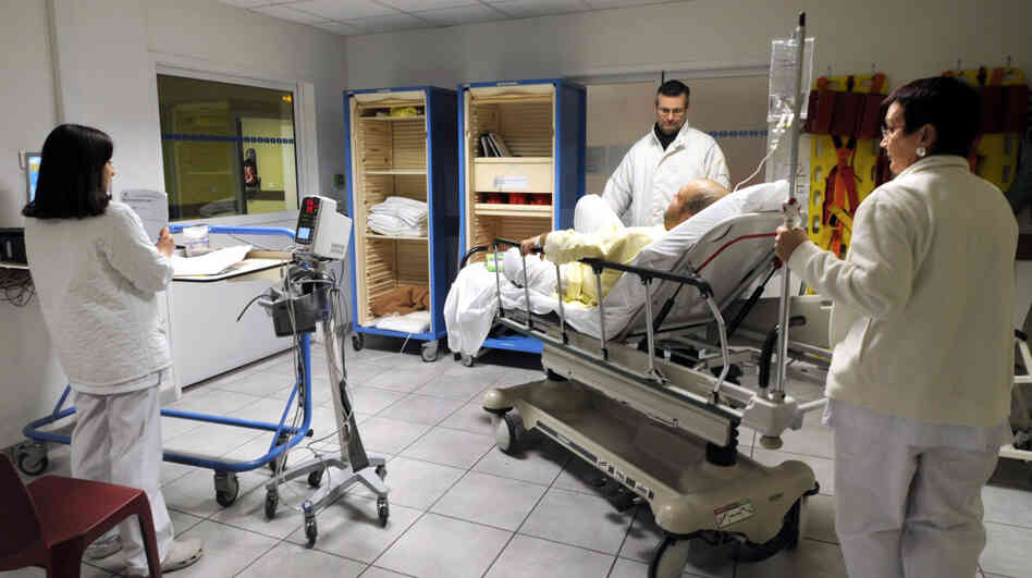 A patient is treated at the Nord Hospital in Marseille, France, in February. European countries have also been engaged in intense debates on the future of their health care systems, where universal coverage is the norm. 