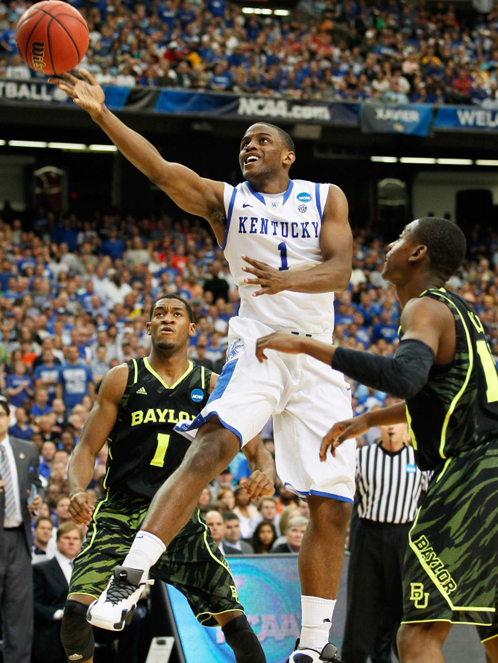 Senior guard Darius Miller of Kentucky shoots during the Wildcats' win over Baylor in the South Regional final. Kentucky, the NCAA Tournament's No. 1 seed, faces rival Louisville in the Final Four Saturday.