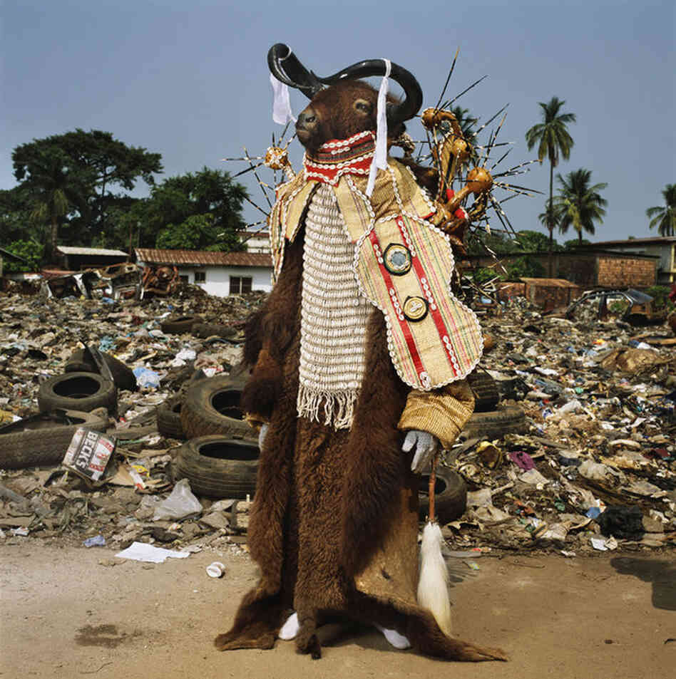 "On festival days in Freetown, Sierra Leone," National Geographic reads, "social clubs parade in the streets, led by an ancestral 'devil.' This fierce and fancy water buffalo spirit is the figurehead for a men's group."