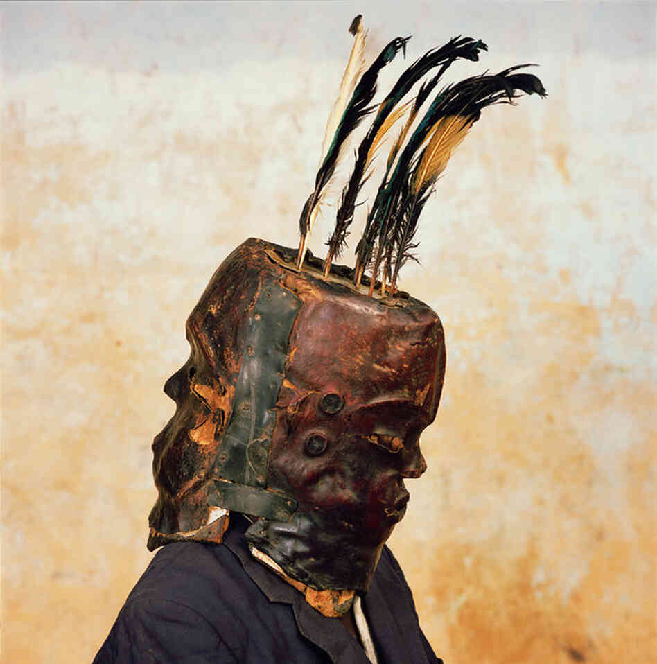 "I took this photograph when I was visiting the Cross River village of Nkim," tells National Geographic. "There was no masquerade going on at the time. But carved-wood, animal-skinned Janus masks like this one appear at funerals, ceremonies honoring Nigerian kings and chiefs, and other rituals."