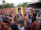 A man holds a portrait of Myanmar opposition leader Aung San Suu Kyi during a rally for a candidate of her National League for Democracy party on Friday. The country is holding elections for some parliamentary seats on Sunday. A man holds a portrait of Myanmar opposition leader Aung San Suu Kyi during a rally for a candidate of her National League for Democracy party on Friday. The country is holding elections for some parliamentary seats on Sunday.