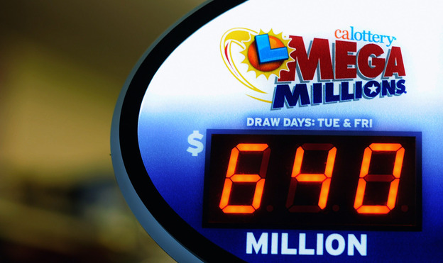 A sign displays the $640 Mega Millions jackpot at Liquorland on in Covina, California.