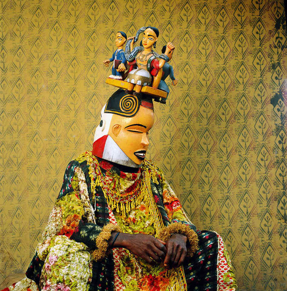 "The diverse Cross River region [in Nigeria] is home to a host of masquerade traditions," the magazine reads. "In the village of Alok a carving of the female water spirit Mami Wata crowns a costumed man's headdress."