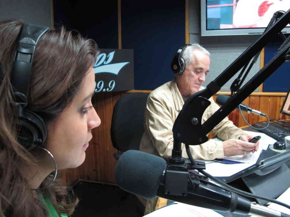Venezuelan radio host Nelson Bocaranda (right) anchors his evening talk show, The Happy Traffic Jam, with co-host Mariela Celis in Caracas during a recent March broadcast.
