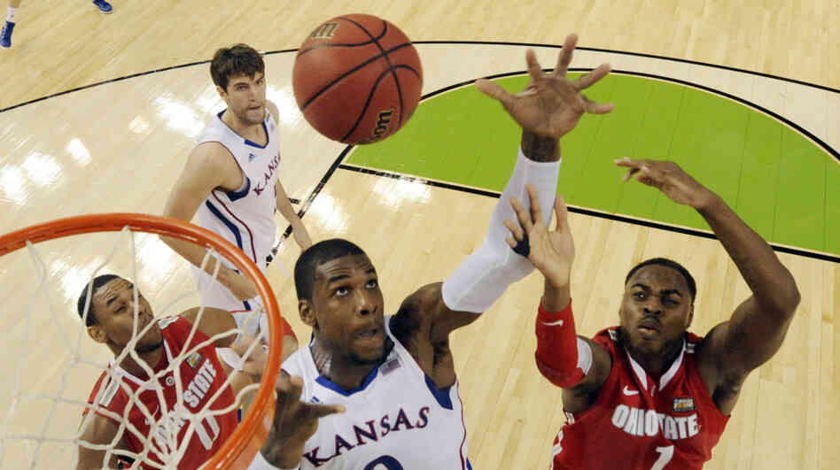 Kansas' Thomas Robinson (0) fights for a rebound with Ohio State's Deshaun Thomas (1) during the second half of an NCAA Final Four semifinal college basketball tournament game Saturday in New Orleans.