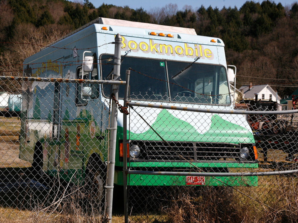The broken-down Cobleigh Public Library bookmobile sits idle at a storage facility in Lyndonville, Vt. Supporters are raising money to put it back on the road.