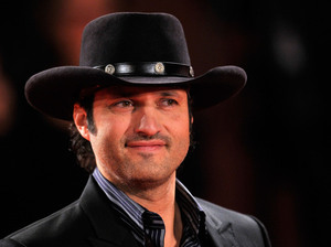 Director Robert Rodriguez, whose films including El Mariachi and Spy Kids often feature Hispanic actors, has partnered with Comcast to head the El Rey cable network. Its programming will be aimed at a bicultural, English-speaking audience. Director Robert Rodriguez, whose films including El Mariachi and Spy Kids often feature Hispanic actors, has partnered with Comcast to head the El Rey cable network. Its programming will be aimed at a bicultural, English-speaking audience.