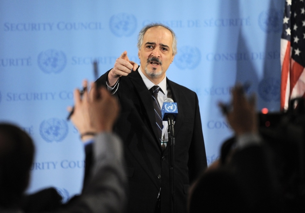 Bashar Ja'afari, Syria's Ambassador to the United Nations, points to reporters asking questions as he speaks to the media outside Security Council chambers on Monday. 