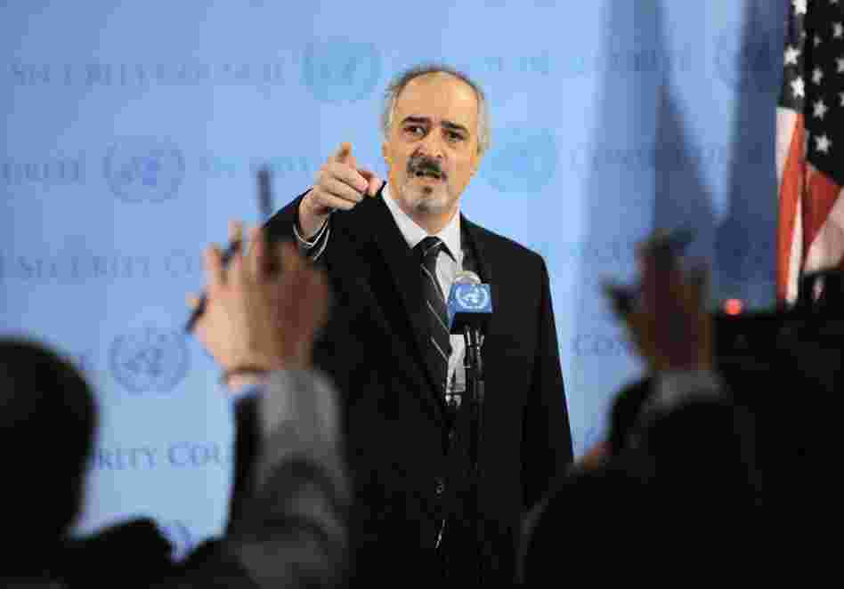 Bashar Ja'afari, Syria's Ambassador to the United Nations, points to reporters asking questions as he speaks to the media outside Security Council chambers on Monday. 