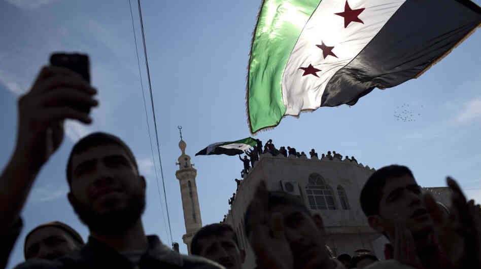Protests in Syria have carried on despite the crackdown by the government's security forces. New Start Radio, an Internet radio station, has reported on events by speaking to citizen journalists around the country. Here, protesters take part in a March 2 demonstration in northern Syria.