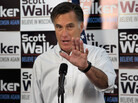 Mitt Romney has campaigned in the shadow of embattled Republican Gov. Scott Walker, who faces a recall vote in June. Here, Romney speaks with Walker supporters at a phone bank during a campaign stop in Fitchburg, Wis., on Saturday. Mitt Romney has campaigned in the shadow of embattled Republican Gov. Scott Walker, who faces a recall vote in June. Here, Romney speaks with Walker supporters at a phone bank during a campaign stop in Fitchburg, Wis., on Saturday.